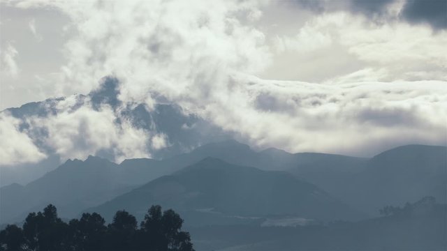 4K Timelapse Sequence of Quitsato, Ecuador - The Cayambe Mountain during a cloudy day as seen from Quitsato Sundial (close-up)