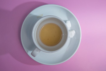 coffee cup over pink background . sugar .Glass cup isolated on a pink background with clipping path. Front view .
