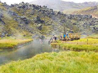 Hot spring in colorful mountains in Iceland 