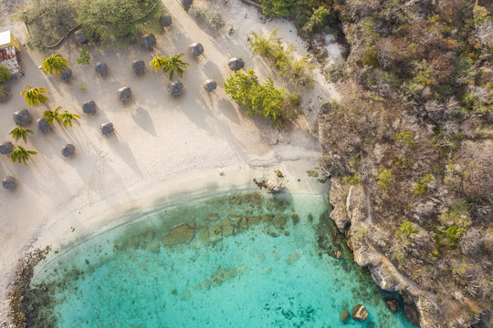 Aerial view of coast of Cura&ccedil;ao in the Caribbean Sea with turquoise water, cliff, beach and beautiful coral reef around Playa Daaibooi