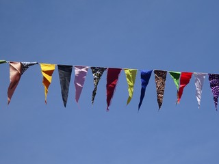 colorful flags on blue sky