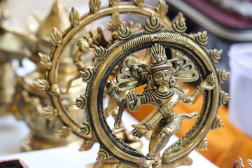 Fototapeta na wymiar Brass Metal Statue Of Lord God Idol Shiva in Natraj Dance Posture