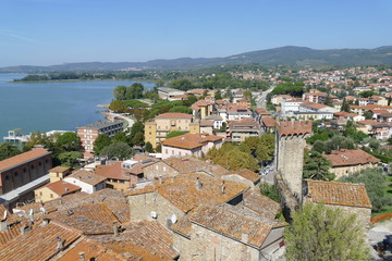 Fototapeta na wymiar Passignano on Trasimeno Lake panorama from the tower of the Castle on the lake and on the village