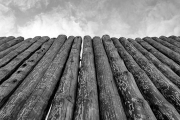 Fence made of logs. Wood Background