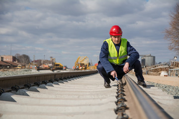 Railway worker working on railway track