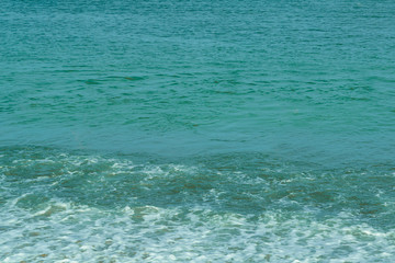 Greenish water in the sea off the coast.