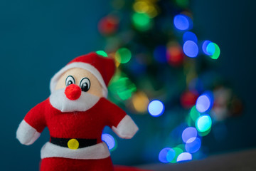 Santa Cluas  composition on the green wall background  Beautiful decoration and elegant accessories. Merry Christmas and Happy Holidays, lighting on Christmas tree 