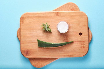 Aloe vera cream and leaf cuts, smiley face concept, healthcare, benefit for health