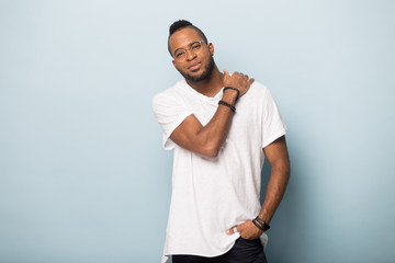 Portrait of handsome young African American man looking at camera