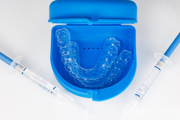 blue case with polymer mouthguards and syringes with gel for tooth separation