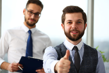 Male arm show OK or confirm during conference in office