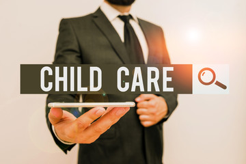 Handwriting text Child Care. Conceptual photo a care of children especially as a service while parents at work Male human wear formal work suit hold smart hi tech smartphone use one hand