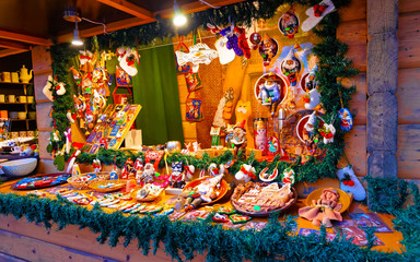 Christmas Ceramics Decorations on Christmas Market at Riga, Latvia. Advent Fair, and Stalls with Crafts Items in Bazaar. Night street Xmas and holiday fair in European city or town, December.