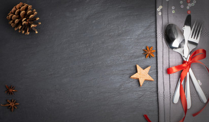 Christmas Dinner Table Setting with Cutlery and Winter Spices