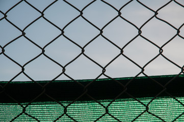 fence with the sky behind