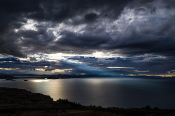 Fototapeta na wymiar Sunset on Lake Titicaca. View from the Pachatata peak. Peru