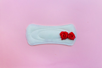  Feminine hygiene products: pad, swab. on a pink background