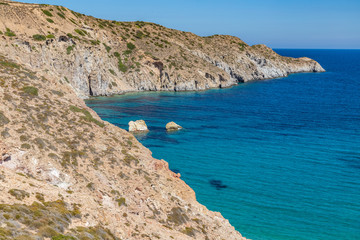 Cliffs, rocks and sand in Firopotamos beach