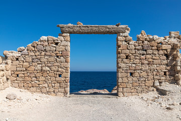 Ruins  around Firopotamos beach with ocean in background