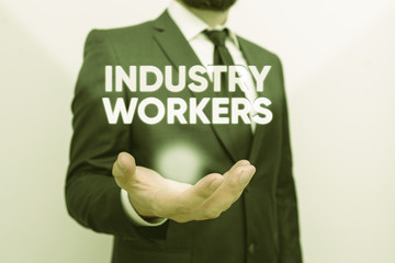 Conceptual hand writing showing Industry Workers. Concept meaning one that works especially at analysisual or industrial labor Male human with beard wear formal working suit clothes hand