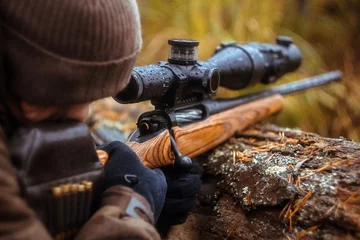 Fototapeten a rifle with a telescopic sight. hunting in the forest © Павел Ващенков