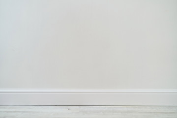 Empty room with white cement wall texture and white wooden floor pattern. 