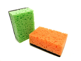 Kitchen washcloths isolated on white background. Composition of orange and green sponges. Washcloths for cleaning.