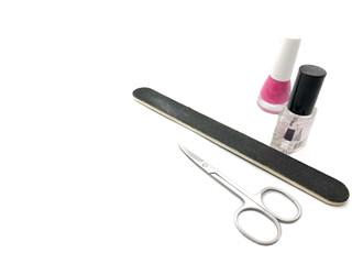 Naklejka premium Scissors, nail file, varnishes isolated on a white background. Composition of tools for a beauty salon. A set of tools for nail care.