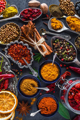 Spices and herbs in metal bowls. Food and cuisine ingredients. Colorful natural additives.