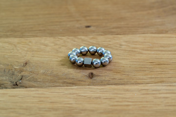 metal ball in a cube of square magnets