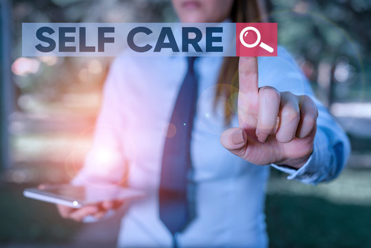 Word writing text Self Care. Business photo showcasing practice of taking action preserve or improve ones own health Handsome business girl pointing with finger into empty space
