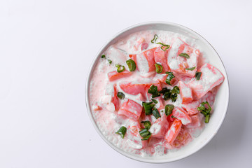 Tomatoes and sour cream in a bowl
