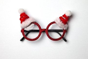 New Year's Santa glasses on a white background, Christmas symbol, fashionable accessory for the holiday