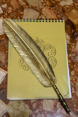 pen and Notepad gold color close up