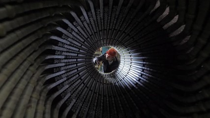  energy engineer inspects the generator stato - Powered by Adobe