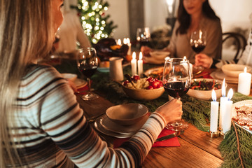Cropped photo of caucasian people having Christmas dinner