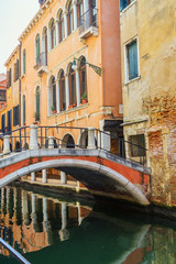 Venice, Italy. Low stone bridge over the canal