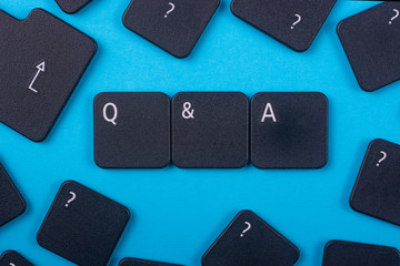 Acronym from keyboard buttons with letters. Q&A.Blue background.