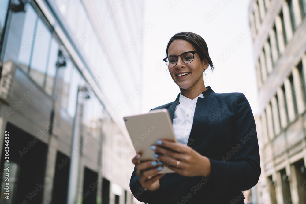 Poster positive female trader enjoying break time for communication with friends in social network using 4g