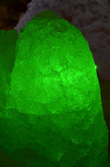 Translucent ice aggregate shine by virid green, illuminated from back-side. A false-crystal of...