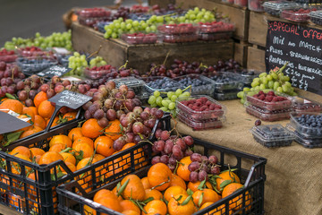 Boxes of various fruits in grocery store