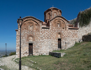 Fototapeta na wymiar Church of the Holy Trinity with Cobblestone Path in Berat Fortress