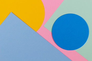 Abstract colored paper texture background. Geometric shapes and lines in blue, light green, yellow,...