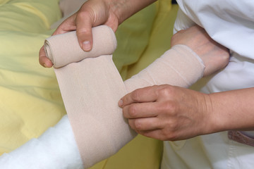 Lymphedema management: Wrapping Lymphedema Hand and Arm using multilayer bandages to control Lymphedema. Part of complete decongestive therapy (cdt) and manual lymphatic drainage (MLD)