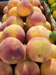 Box of Ripe Peaches at a Farmer's Market