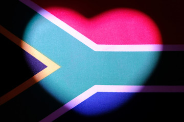 South Africa flag on which a light spot in the form of a heart. Symbol of the relationship and feelings of the newlyweds. The concept of love, patriotism and independence. Valentine's Day.