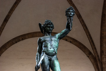 Florence, Italy - Perseus defeats Medusa sculpture, made by Benvenuto Cellini and located in Loggia dei Lanzi, in Piazza della Signoria