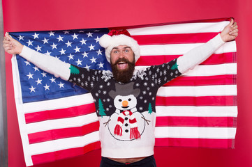 Christmas holiday. Guy celebrate christmas. Cheerful hipster. Love your country. Christmas in United States of America. Greetings to all my compatriots. American man hold USA flag. National spirit