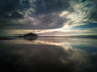 st michaels mount beach and reflection on a stormy day 