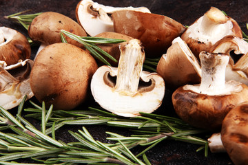 flat lay of mushrooms with rosemary. organic tasty mushrooms
